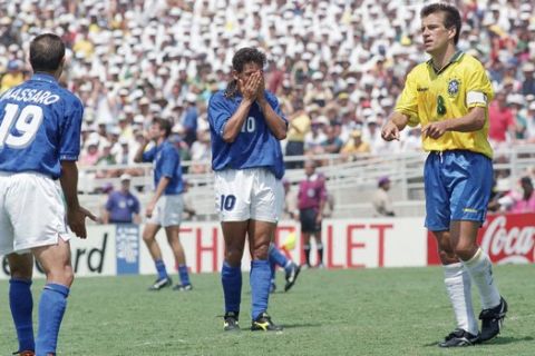 FILE - In this Sunday, July 17, 1994 filer, Italy's Roberto Baggio holds his head in his hands after missing a penalty kick in the World Cup final against Brazil, at the Rose Bowl in Pasadena, Calif. The best players in the world go elsewhere. The best coaches in Italy emigrate. The stadiums around the country are falling apart. The lingering problems affecting Italy's domestic league might just be the reason for the country's failure to qualify for next year's World Cup. (AP Photo/Thomas Kienzle, File)