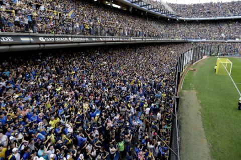 Thousands of Argentina's Boca Juniors fans watch a training session of their team, from the stands of the Bombonera stadium, in Buenos Aires, Argentina Thursday, Nov. 22, 2018. Boca Juniors faces River Plate for the Copa Libertadores soccer final game on Saturday. (AP Photo/Natacha Pisarenko)