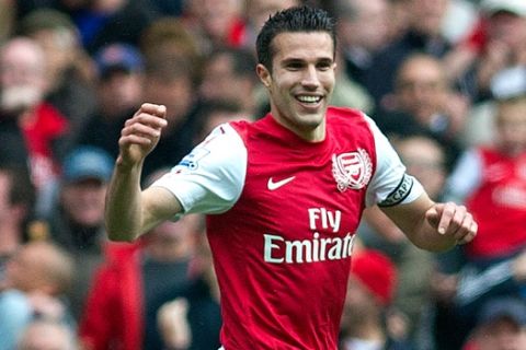 Arsenal's Robin van Persie, reacts, during  their English Premier League soccer match against Norwich City, at Emirates stadium in London, Saturday, May 05, 2012. (AP Photo/Bogdan Maran)
