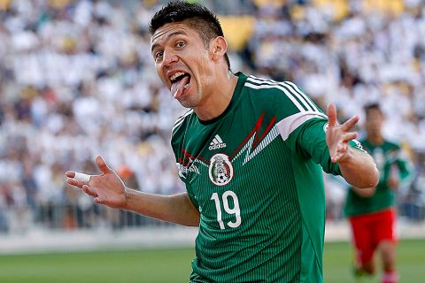Oribe Peralta of Mexico celebrates a goal against New Zealand during their World Cup qualifying football match at Westpac Stadium in Wellington on November 20, 2013.     AFP PHOTO / MARTY MELVILLE

