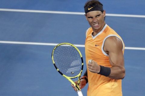 Spain's Rafael Nadal celebrates after defeating United States' Frances Tiafoe in their quarterfinal match at the Australian Open tennis championships in Melbourne, Australia, Tuesday, Jan. 22, 2019. (AP Photo/Kin Cheung)