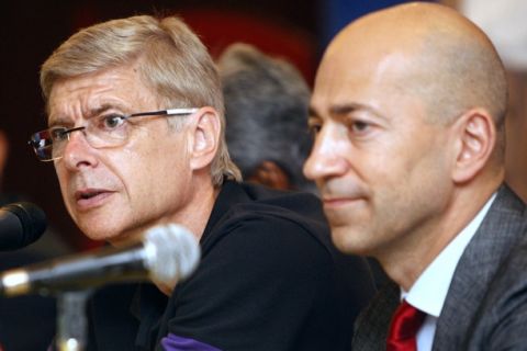 Arsenal's manager Arsene Wenger, left, speaks as chief executive Ivan Gazidis listens during a press conference in Kuala Lumpur, Malaysia, Sunday, July 22, 2012. Arsenal will play the Malaysian XI, a Malaysia League selection, on Tuesday as part of their Asia tour. (AP Photo/Lai Seng Sin)