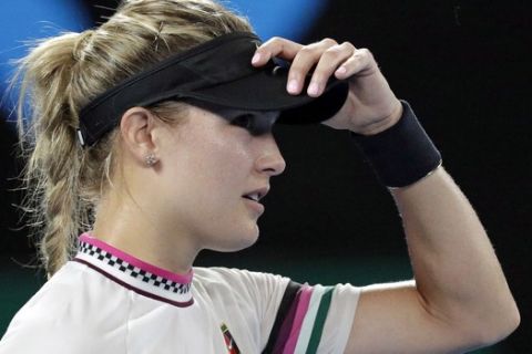 Canada's Eugenie Bouchard adjusts her cap during her second round match against United States' Serena Williams at the Australian Open tennis championships in Melbourne, Australia, Thursday, Jan. 17, 2019. (AP Photo/Aaron Favila)