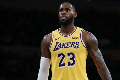Los Angeles Lakers forward LeBron James attempts a free throw during the first half of an NBA preseason basketball game against the Sacramento Kings in Los Angeles, Thursday, Oct. 4, 2018. (AP Photo/Kelvin Kuo)