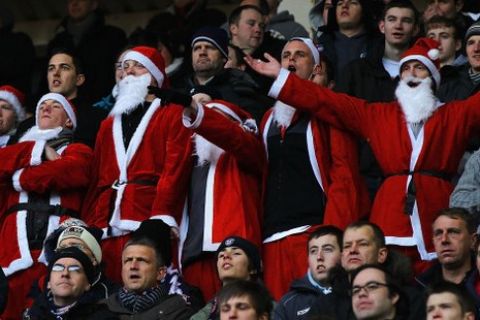 SUNDERLAND, ENGLAND - DECEMBER 18:  Bolton Wanderers supporters dressed as Santa Claus watch from the stands during the Barclays Premier League match between Sunderland and Bolton Wanderers at Stadium of Light on December 18, 2010 in Sunderland, England.  (Photo by Matthew Lewis/Getty Images)