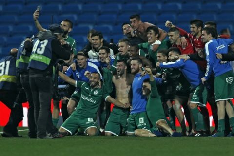 Leganes' players celebrate their victory against Real Madrid at the end of the Spanish Copa del Rey quarterfinal second leg soccer match between Real Madrid and Leganes at the Santiago Bernabeu stadium in Madrid, Wednesday, Jan. 24, 2018. Leganes won 2-1. (AP Photo/Francisco Seco)