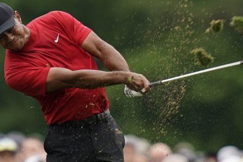 Tiger Woods hits on the 12th hole during the final round for the Masters golf tournament, Sunday, April 14, 2019, in Augusta, Ga. (AP Photo/David J. Phillip)