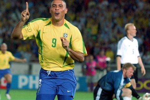 FILE - In this June 30, 2002,  file photo, Brazil's Ronaldo reacts after scoring past Germany's goalkeeper Oliver Kahn, center, and Carsten Ramelow during the 2002 World Cup final soccer match at the Yokohama stadium in Yokohama, Japan. With one week to go before the World Cup starts in Brazil, The Associated Press takes a look at 10 great stars in the tournament's history. Ronaldo the striker is the most prolific scorer in World Cups with 15 goals. He was a youngster in the Brazilian squad that won the 1994 World Cup, then helped Brazil reach the final both in 1998 and 2002. He had convulsions the day of the 1998 final in France and didn't play well in Brazil's 3-0 loss to the hosts, but four years in later in South Korea and Japan he scored twice in the final to give Brazil its fifth world title. Ronaldo's last World Cup was in 2006. (AP Photo/Dusan Vranic, File) ORG XMIT: WCGP102