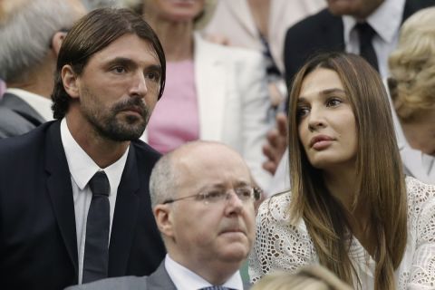 Retired Croatian tennis player Goran Ivanisevic, left, and Tatjana Dragovic arrive to watch Novak Djokovic of Serbia face Roger Federer of Switzerland during a semifinals match at the All England Lawn Tennis Championships at Wimbledon, England, Friday, July 6, 2012. (AP Photo/Anja Niedringhaus)