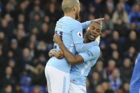 Manchester City's David Silva, left, celebrates with Manchester City's Fernandinho after Manchester City's Gabriel Jesus scored during the English Premier League soccer match between Leicester City and Manchester City at the King Power Stadium in Leicester, England, Saturday, Nov. 18, 2017. (AP Photo/Rui Vieira)
