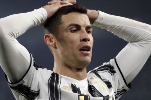 Juventus' Cristiano Ronaldo reacts after failing to score during the Champions League, round of 16, second leg, soccer match between Juventus and Porto in Turin, Italy, Tuesday, March 9, 2021. (AP Photo/Luca Bruno)