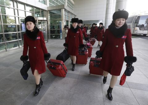 North Korean cheering squads arrive at the Korean-transit office near the Demilitarized Zone in Paju, South Korea, Wednesday, Feb. 7, 2018. A North Korean delegation, including members of a state-trained cheering group, arrived in South Korea on Wednesday for the Pyeongchang Winter Olympics. (AP Photo/Ahn Young-joon. Pool)