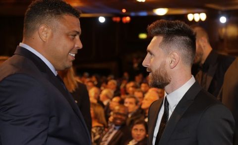 Brazilian soccer legend Ronaldo, left, and Argentinian soccer player Lionel Messi chat during the The Best FIFA 2017 Awards at the Palladium Theatre in London, Monday, Oct. 23, 2017. (AP Photo/Alastair Grant)