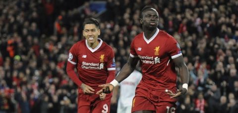 Liverpool's Sadio Mane, right, celebrates with his teammates after scoring his side's fourth goal during the Champions League Group E soccer match between Liverpool and Spartak Moscow at Anfield, Liverpool, England, Wednesday, Dec. 6, 2017. (AP Photo/Rui Vieira)