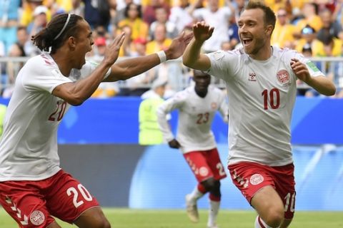 Denmark's Christian Eriksen celebrates with his teammate Yussuf Yurary Poulsen after scoring the opening goal during the group C match between Denmark and Australia at the 2018 soccer World Cup in the Samara Arena in Samara, Russia, Thursday, June 21, 2018. (AP Photo/Martin Meissner)