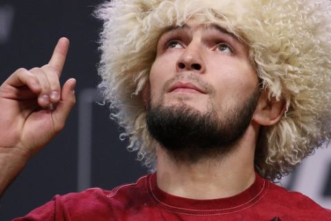 Khabib Nurmagomedov poses during a ceremonial weigh-in for the UFC 229 mixed martial arts fight Friday, Oct. 5, 2018, in Las Vegas. Nurmagomedov is scheduled to fight Conor McGregor Saturday in Las Vegas. (AP Photo/John Locher)