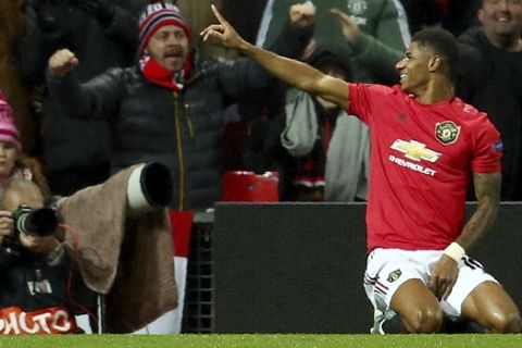 Manchester United's Marcus Rashford celebrates after scoring his side's third goal during the Europa League group L soccer match between Manchester United and FK Partizan at Old Trafford Stadium in Manchester, England, Thursday, Nov. 7, 2019. (AP Photo/Dave Thompson)