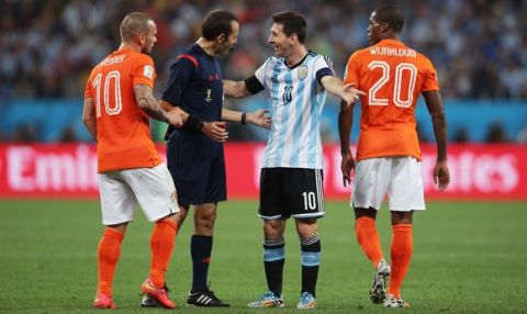 SAO PAULO, BRAZIL - JULY 09:  Lionel Messi of Argentina protests to referee Cuneyt Cakir during the 2014 FIFA World Cup Brazil Semi Final match between the Netherlands and Argentina at Arena de Sao Paulo on July 9, 2014 in Sao Paulo, Brazil.  (Photo by Dean Mouhtaropoulos/Getty Images)