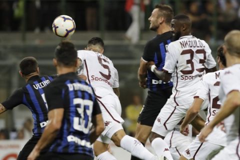 Inter Milan's Stefan De Vrij, right, heads the ball to score during a Serie A soccer match between Inter Milan and Torino, at the San Siro stadium in Milan, Italy, Sunday, Aug. 26, 2018. (AP Photo/Luca Bruno)