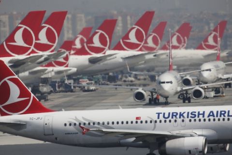 Turkish Airlines airplanes at Ataturk International Airport, in Istanbul, Friday, April 5, 2019, ahead of its closure. The relocation from Ataturk International Airport to Istanbul Airport on the Black Sea shores dubbed the "Great Move"began early Friday and is expected to end Saturday. Ataturk Airport, ranked 17th busiest in the world in 2018 according to preliminary statistics, will cease commercial operations at 02:00 am local Saturday (2300 GMT Friday.) (AP Photo/Lefteris Pitarakis)