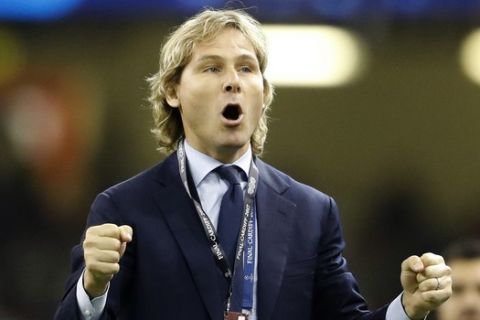 Former Juventus player Pavel Nedved gestures before the Champions League final soccer match between Juventus and Real Madrid at the Millennium stadium in Cardiff, Wales Saturday June 3, 2017. (AP Photo/Frank Augstein)