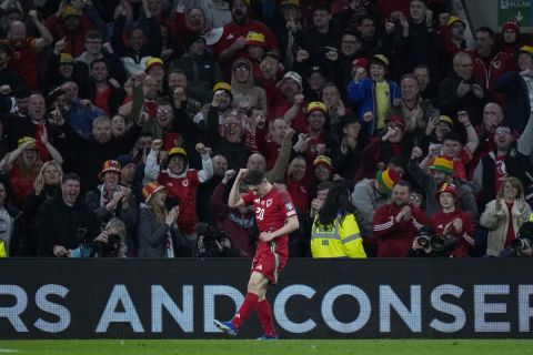 Wales' Daniel James celebrates after scoring during the UEFA European Championship play-off match against Finland at the Cardiff City Stadium in Cardiff, Wales, Thursday, March 21, 2024. (AP Photo/Alastair Grant)