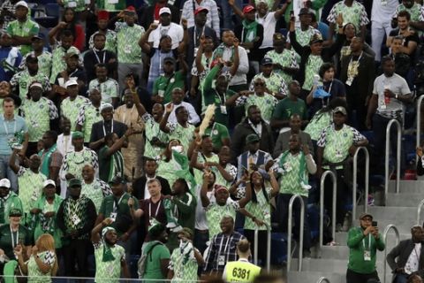 Nigerian fans celebrate after the opening goal their team during the group D match between Argentina and Nigeria, at the 2018 soccer World Cup in the St. Petersburg Stadium in St. Petersburg, Russia, Tuesday, June 26, 2018. (AP Photo/Petr David Josek)