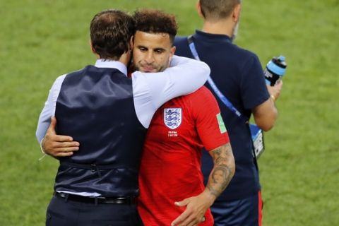 England's Kyle Walker embraces England head coach Gareth Southgate after being substituted during the round of 16 match between Colombia and England at the 2018 soccer World Cup in the Spartak Stadium, in Moscow, Russia, Tuesday, July 3, 2018. (AP Photo/Antonio Calanni)