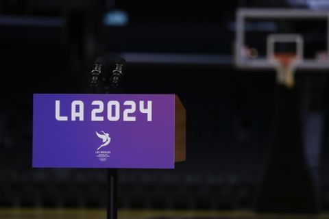 A podium sits on the court before a news conference with Los Angeles Mayor Eric Garcetti and Los Angeles 2024 Chairman Casey Wasserman at Staples Center, Friday, May 12, 2017, in Los Angeles. The International Olympic Committee officials wrapped up four days of evaluating Los Angeles' bid for the 2024 Games before heading to Paris to check the only other candidate. (AP Photo/Jae C. Hong)