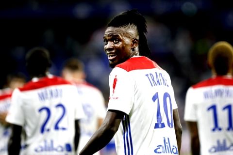 Lyon's Bertrand Traore celebrates after he scored a goal against Strasbourg during their French League One soccer match in Decines, near Lyon, central France, Friday, Aug. 24, 2018. (AP Photo/Laurent Cipriani)