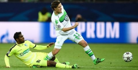"Gent's Brazilian midfielder Renato Neto (L) and Wolfsburg's striker Max Kruse vie for the ball during the second-leg round of 16 UEFA Champions league football match between VfL Wolfsburg and KAA Gent at the Volkswagen arena in Wolfsburg on March 8, 2016.   .. / AFP / ODD ANDERSEN        (Photo credit should read ODD ANDERSEN/AFP/Getty Images)"