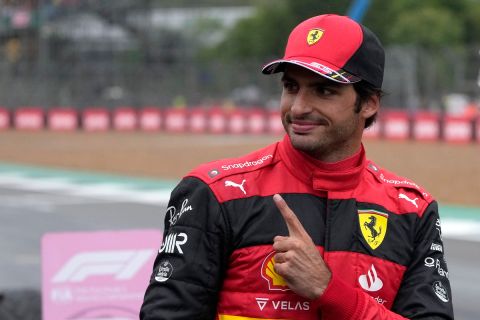 Ferrari driver Carlos Sainz of Spain celebrates after he clocked the fastest time during the qualifying session for the British Formula One Grand Prix at the Silverstone circuit, in Silverstone, England, Saturday, July 2, 2022. The British F1 Grand Prix is held on Sunday July 3, 2022. (AP Photo/Matt Dunham, Pool)