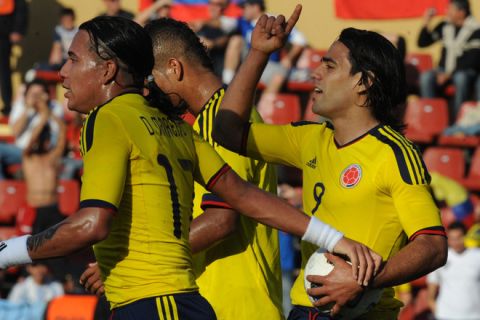Colombian forward Radamel Falcao (R) celebrates next to teammate forward Dayro Moreno, after scoring off a penalty kick, during a 2011 Copa America Group A first round football match, at the Cementerio de Elefantes stadium in Santa Fe, 476 Km north of Buenos Aires, on July 10, 2011.     AFP PHOTO / MIGUEL ROJO (Photo credit should read MIGUEL ROJO/AFP/Getty Images)