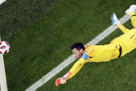 France goalkeeper Hugo Lloris goes for the ball during the semifinal match between France and Belgium at the 2018 soccer World Cup in the St. Petersburg Stadium in St. Petersburg, Russia, Tuesday, July 10, 2018. (AP Photo/Dmitri Lovetsky)