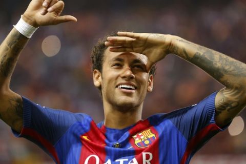 Barcelona's Neymar celebrates at the end of the Copa del Rey final soccer match between Barcelona and Alaves at the Vicente Calderon stadium in Madrid, Spain, Saturday May 27, 2017. (AP Photo/Daniel Ochoa de Olza)