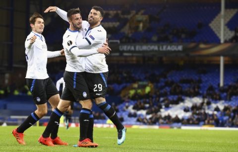 Atalanta's Bryan Cristante celebrates with his teammates after scoring his side second goal during the Europa League group E soccer match between Everton and Atalanta at the Goodison Park stadium in Liverpool, England on Thursday, Nov. 23, 2017. (AP Photo/Dave Thompson)