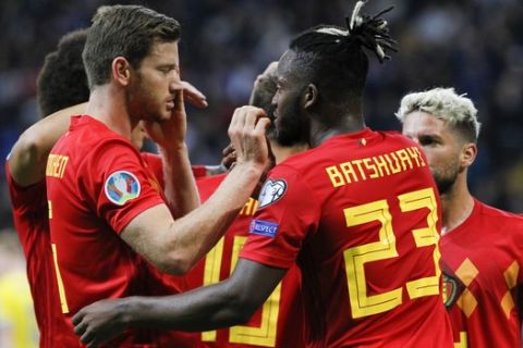Belgium's Michy Batshuayi, second right, celebrates with his teammates after scoring the opening goal during the Euro 2020 group I qualifying soccer match between Kazakhstan and Belgium at the Astana Arena stadium in Nur-Sultan, Kazakhstan, Sunday, Oct. 13, 2019. (AP Photo)