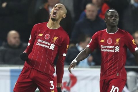Liverpool's Fabinho celebrates after scoring his side's opening goal during the English Premier League soccer match between Liverpool and Manchester City at Anfield stadium in Liverpool, England, Sunday, Nov. 10, 2019. (AP Photo/Jon Super)