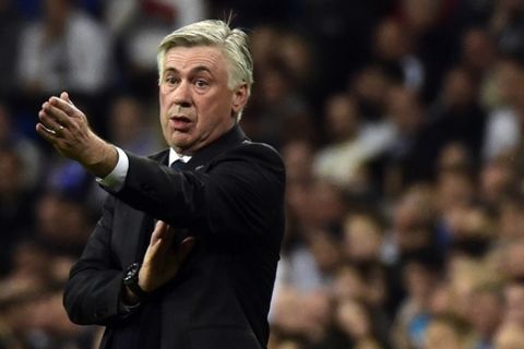 Real Madrid's Italian coach Carlo Ancelotti gestures during the UEFA Champions League round of 16 second leg football match Real Madrid CF vs FC Schalke 04 at the Santiago Bernabeu stadium in Madrid on March 10, 2015.     AFP PHOTO/ GERARD JULIEN        (Photo credit should read GERARD JULIEN/AFP/Getty Images)
