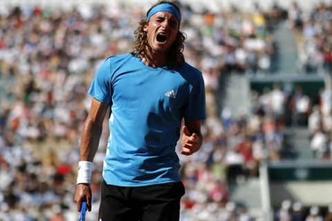 Greece's Stefanos Tsitsipas reacts after missing a shot against Switzerland's Stan Wawrinka during their fourth round match of the French Open tennis tournament at the Roland Garros stadium in Paris, Sunday, June 2, 2019. (AP Photo/Christophe Ena)