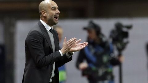 Manchester City's manager Pep Guardiola shouts instructions to his players during a Champions League round of 16 second leg soccer match between Monaco and Manchester City at the Louis II stadium in Monaco, Wednesday March 15, 2017. (AP Photo/Claude Paris)