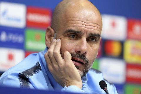 Manchester City manager Pep Guardiola reacts during the media conference at Tottenham Hotspur Stadium in London, Monday April 8, 2019.  Man City will play Tottenham in a Champions League Quarter Final first leg soccer match on upcoming Tuesday. (Bradley Collyer/PA via AP)