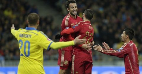 Spain's defender Mario Gaspar Perez (2nd L) celebrates after scoring during the Euro 2016 qualifying football match between Ukraine and Spain at Olympiysky stadium in Kiev on October 12, 2015.  AFP PHOTO / ANATOLII STEPANOV        (Photo credit should read ANATOLII STEPANOV/AFP/Getty Images)