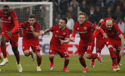 Lyon players celebrate at the end of a penalty shootout during a Europa League quarterfinal, second leg soccer match between Besiktas and Lyon in Istanbul, Turkey, Thursday April 20, 2017. The match finished 3-3 on aggregate with Lyon winning the tie after extra time and penalties. (AP Photo/Emrah Gurel)