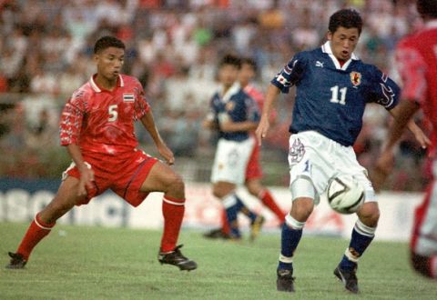 Thailand's Jakaraj Tonhongsa, left, pursues Japan's Kazuyoshi Miura during first half action of the 28th King's Cup soccer match in Bangkok Sunday, Feb. 9, 1997. Japan and Thailand tied 1-1. (AP Photo/Siam Sport) **THAILAND OUT**
