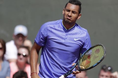 Australia's Nick Kyrgios grimaces as he plays Germany's Philipp Kohlschreiber during their first round match of the French Open tennis tournament at the Roland Garros stadium, Tuesday, May 30, 2017 in Paris. (AP Photo/Petr David Josek)
