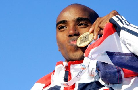 FILE This Sunday, Dec. 10, 2006 file photo shows Britain's Mo Farah kissing the gold medal as he celebrates on the podium after winning the European Cross Country Championships, in San Giorgio su Legnano, near Milan, Italy.  Farewell London. Hello Portland, Oregon. Mo Farah has left his world behind so he can focus on his Olympic rendezvous this August. Family, friends, the London football club _ Arsenal _ he adores are thousands of miles and many time zones away, a self-imposed exile which suits the 5,000-meter world champion just fine. "In America, here, you just train, you just eat, train, and just get on with training," Farah says. "It worked out well, to be away from everything else, and I can just concentrate on my running and be away from all the media and everything else."(AP Photo/Antonio Calanni, File)