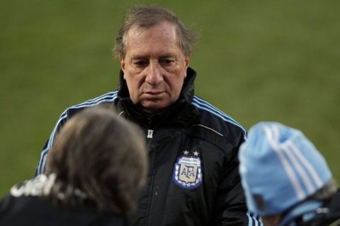Argentina's soccer team manager Carlos Salvador Bilardo talks to aides during a practice in Pretoria, South Africa, Friday, June 18, 2010. Argentina plays in the Group B of the World Cup. (AP Photo/Ricardo Mazalan)