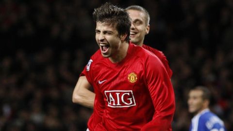 Manchester United's Gerard Pique, centre left, celebrates after scoring against Dynamo Kiev during their Champion's League Group F soccer match at Old Trafford Stadium, Manchester, England, Wednesday Nov. 7, 2007. (AP Photo/Jon Super)