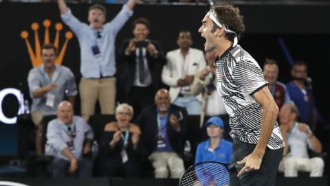 Switzerland's Roger Federer celebrates after defeating Spain's Rafael Nadal in the men's singles final at the Australian Open tennis championships in Melbourne, Australia, Sunday, Jan. 29, 2017. (AP Photo/Dita Alangkara)